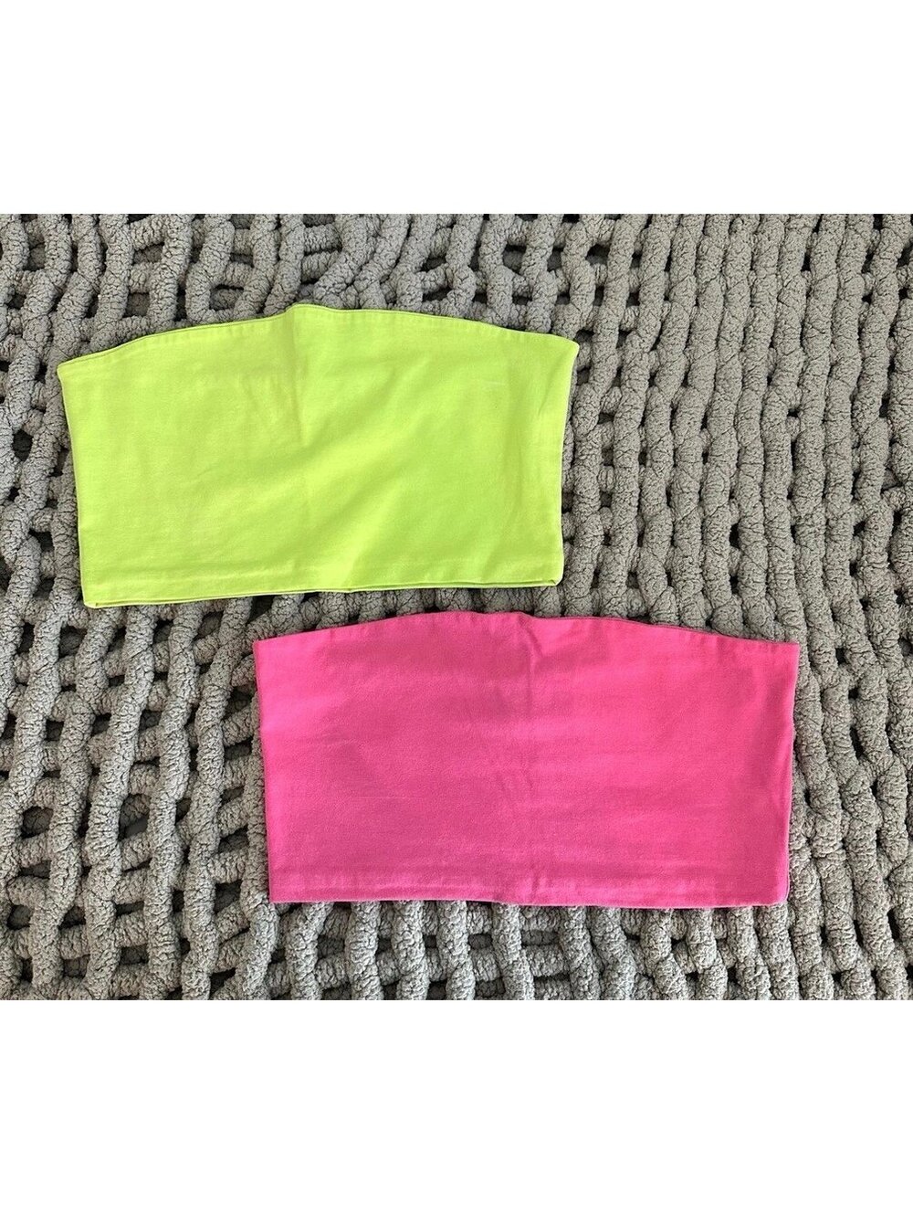 Two neon tube tops, one lime green, one pink